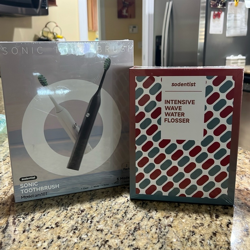 Brand New in Box SODENTIST sonic toothbrush 2 packs and water flosser